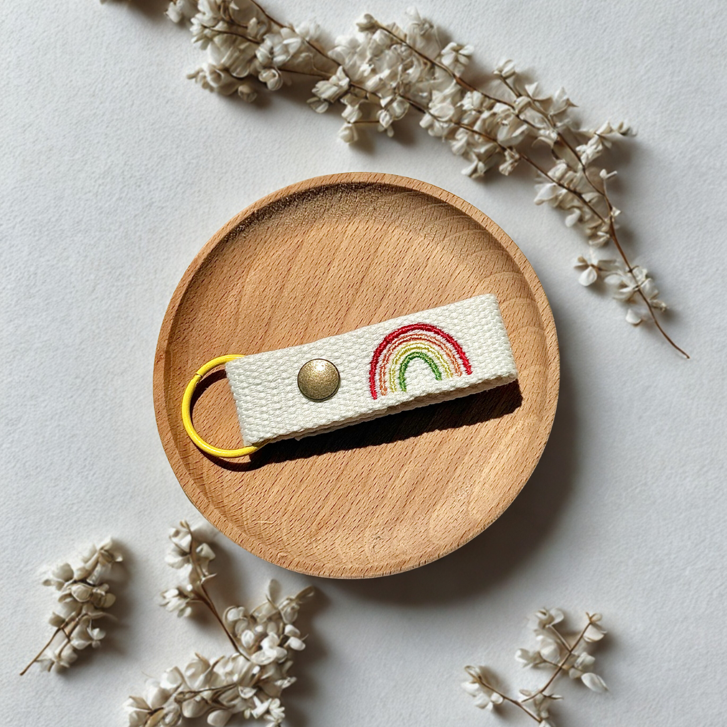 Embroidered name tag with rainbow design