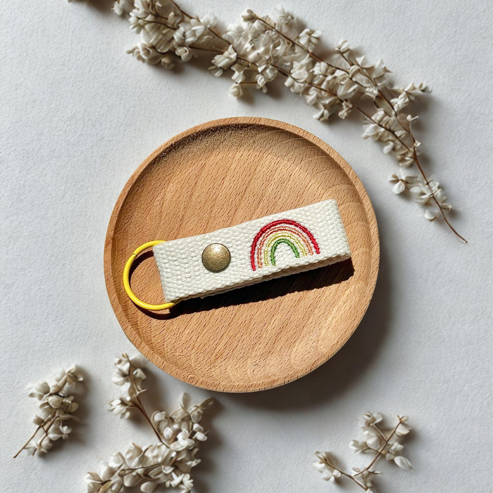 Embroidered name tag with rainbow design